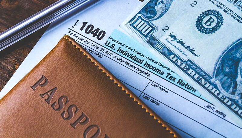 1040 tax return with Passport and $100 bill