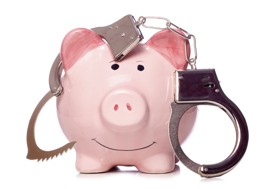 Piggy bank with handcuffs hanging on it