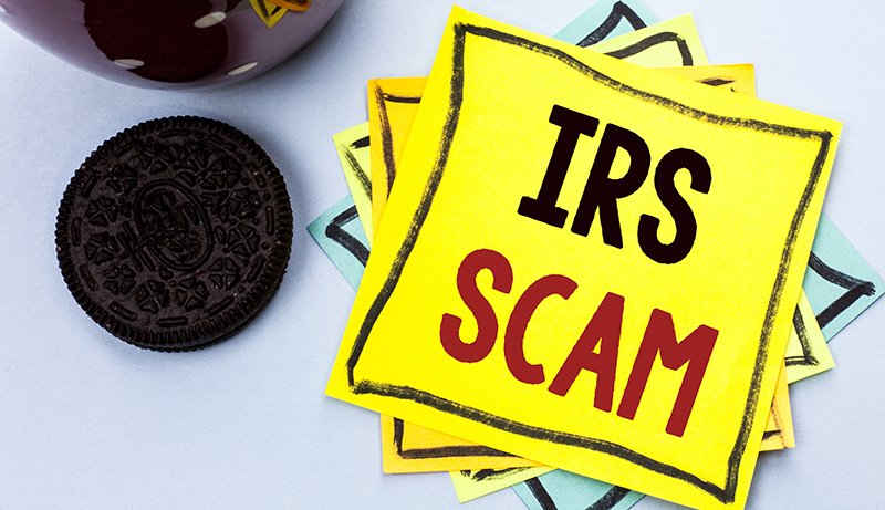 IRS Scam written on a sitcky-note