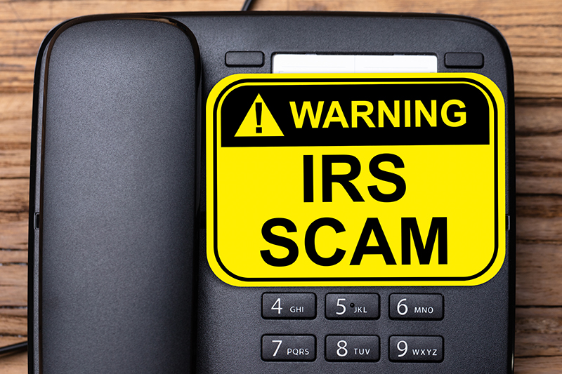 IRS Scam sign on a Telephone