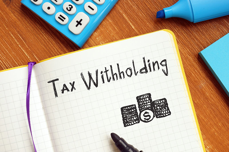 Tax WIthholding written in a notebook