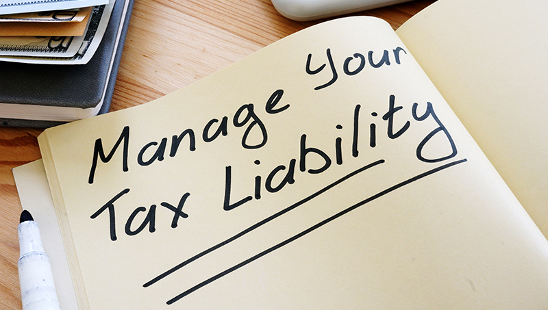 Manage Your Tax Liability written in a notebook