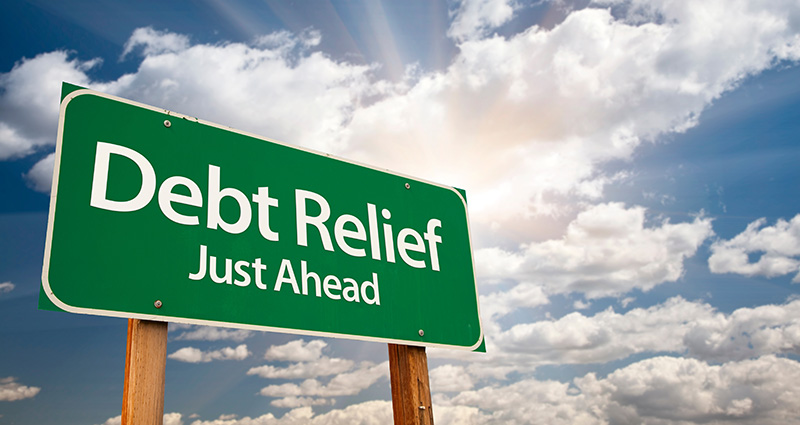 Debt Relief Just Ahead sign