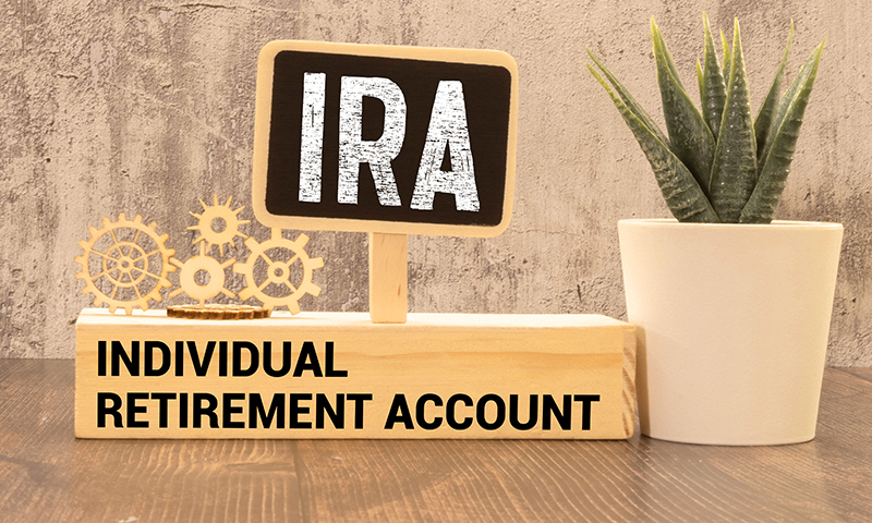 IRA and Individual Retirement Account written on a block of wood