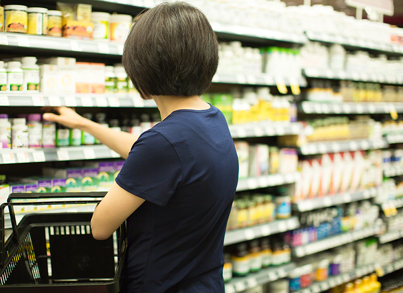 Woman Shopping for Over the Counter Medications