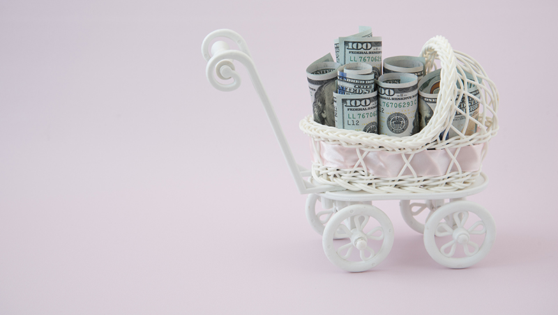 Stroller with rolled up $100 bills