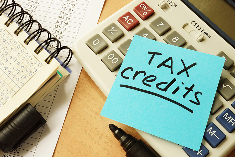 Tax Credits written on a Sticky Note