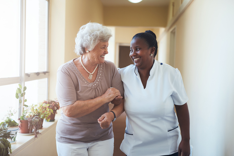 Nurse helping woman