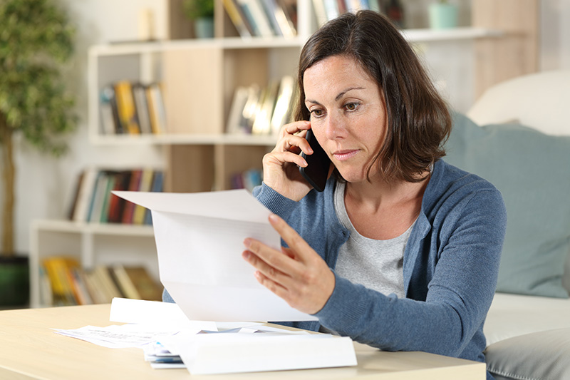 Woman reading a letter on a phone