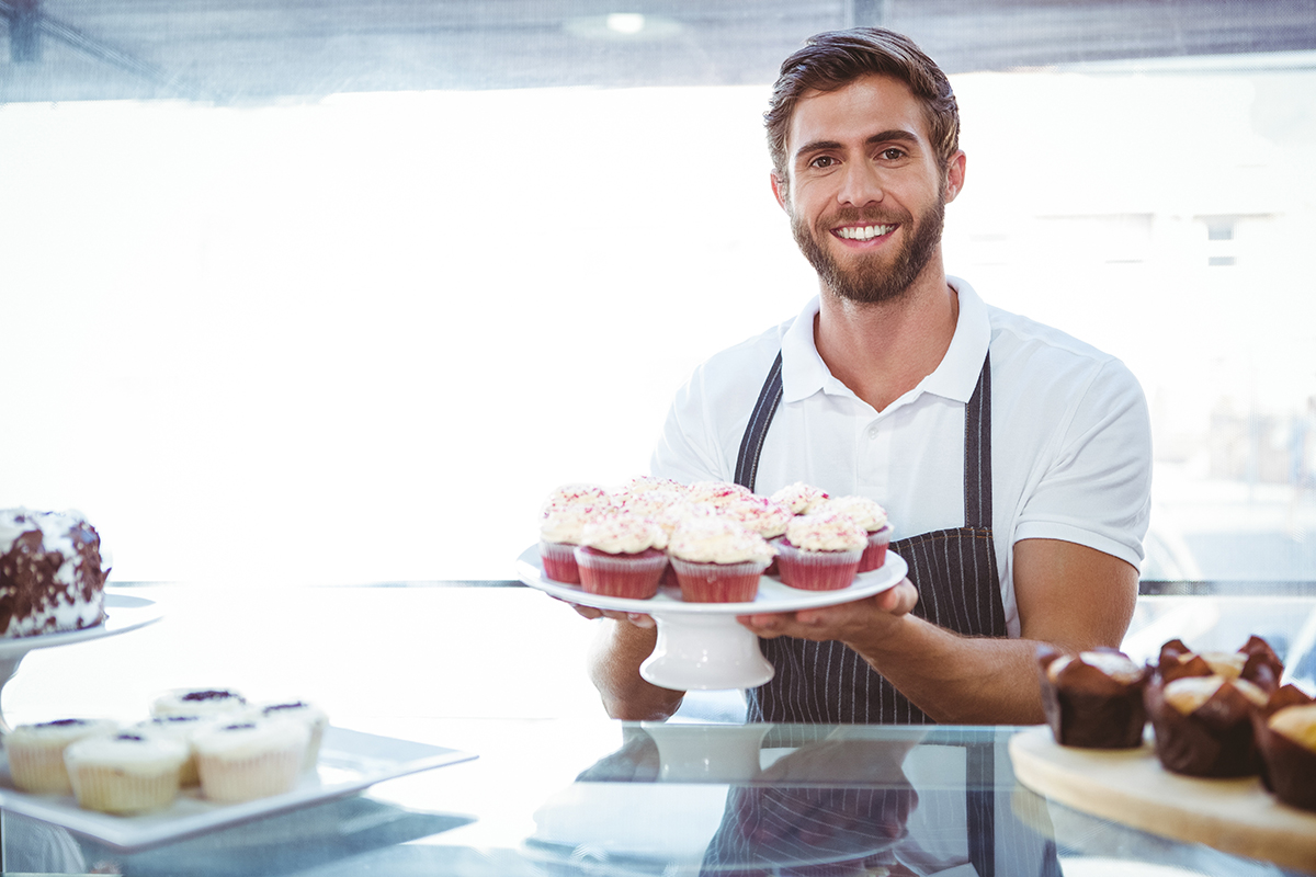 Man Holding Cupcakes