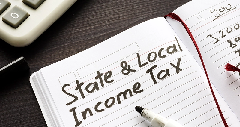 State & Local Income Tax written in a notebook