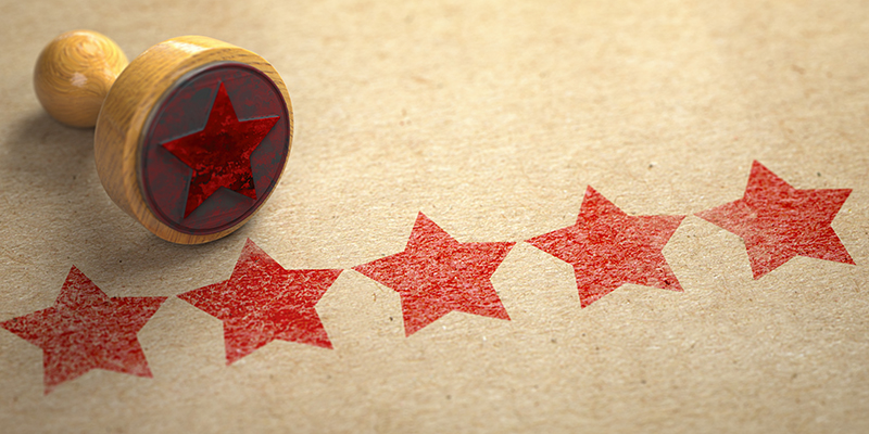 5 stars stamped on a paper