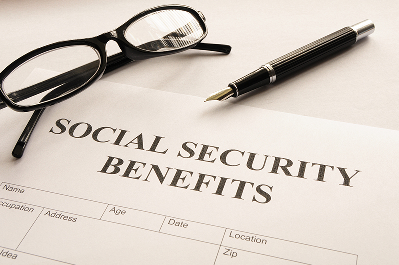 Social Security Benefits Written on Paper