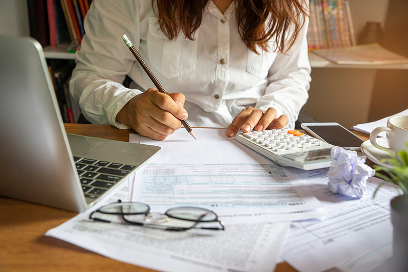 Woman Doing Financial Paperwork