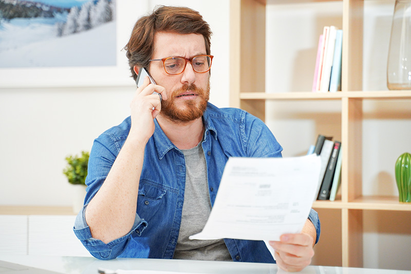 Man looking at a letter