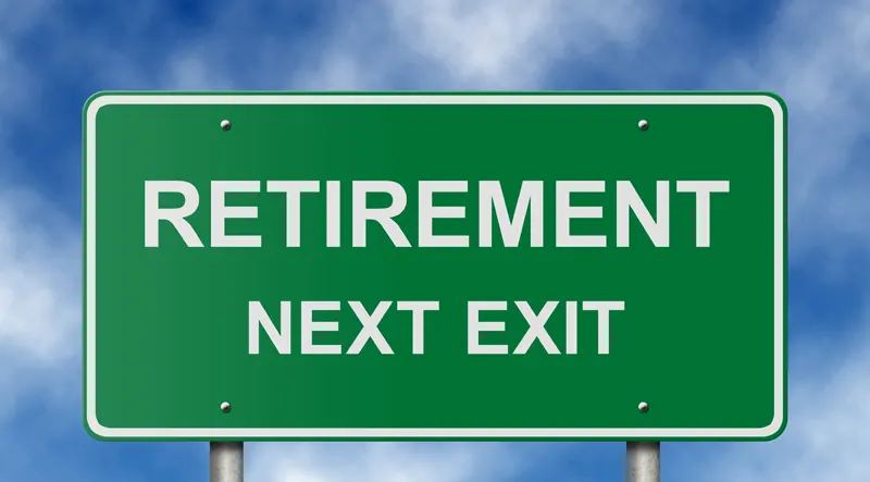 Green sign that says Retirement Next Exit