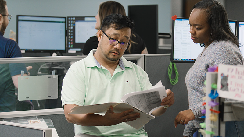 Two TaxAudit Tax Professionals working on a case