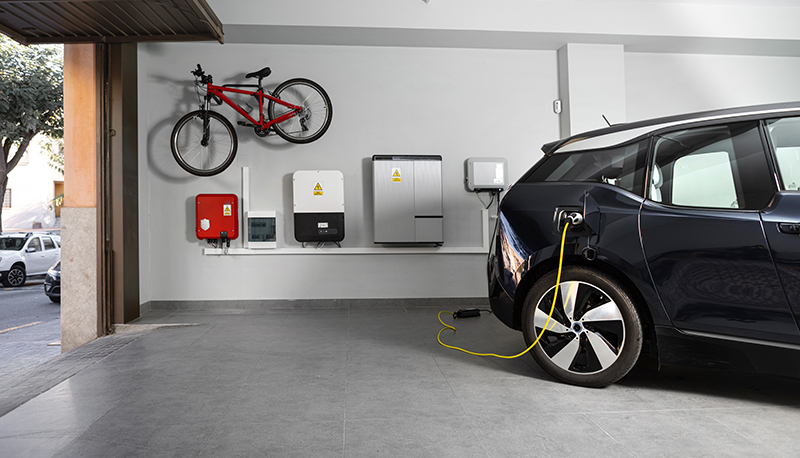 Electric car being charged in garage