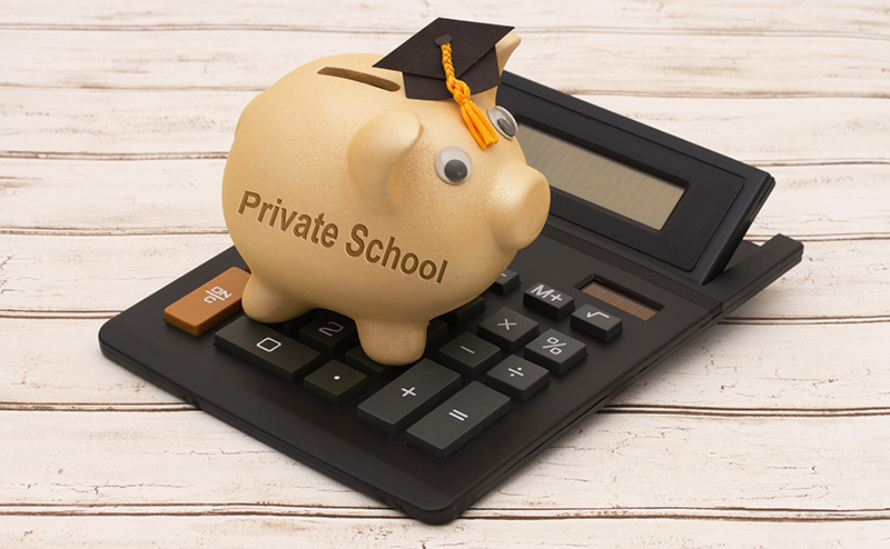 Private School Piggy Bank on a Calculator