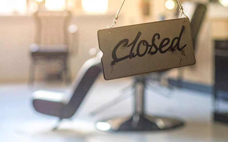 Closed sign outside a hair salon