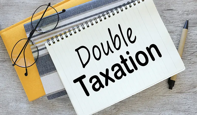Double Taxation written on notepad