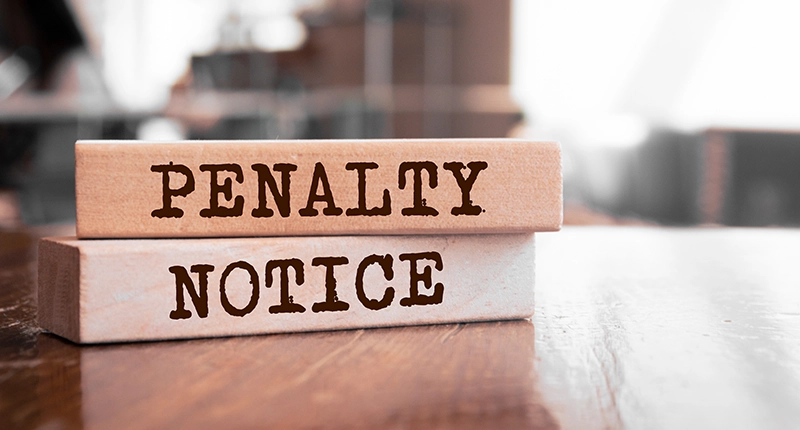 Penalty Notice written on wooden blocks