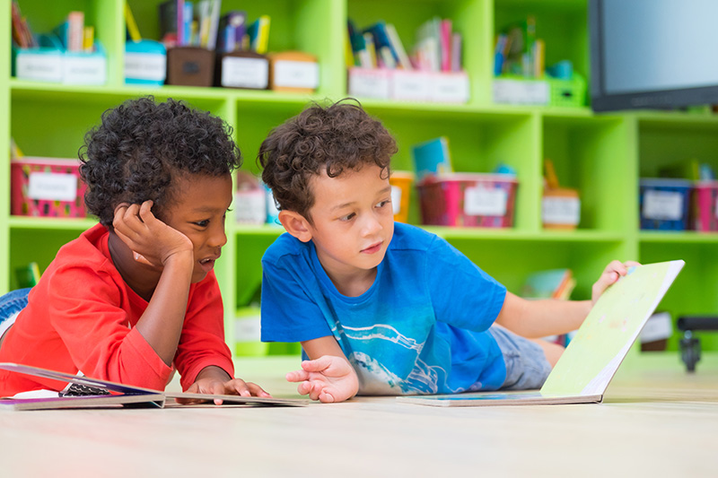 Two Preschoolers Reading