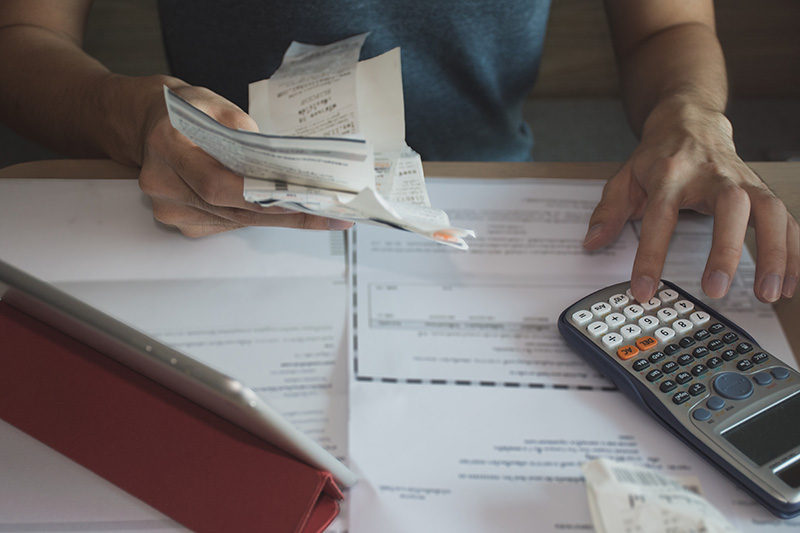 Business Owner Looking at Receipts