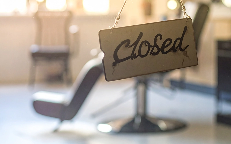 Closed sign outside a hair salon