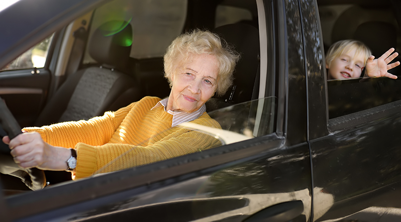 Grandmother driving Grandchild