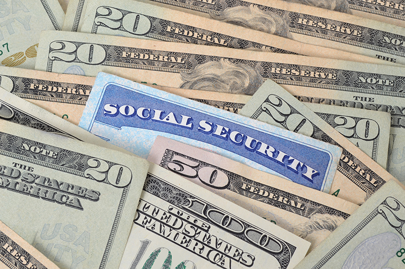 Social Security Card surrounded by cash